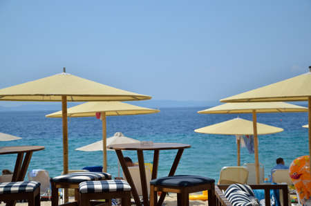 Part of beach bar with a beach and sea behindの写真素材