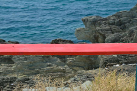 Red plank with sea and sea in backgroundの写真素材