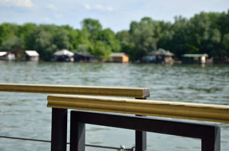 View from terrace at the river and rafts on the other bankの写真素材