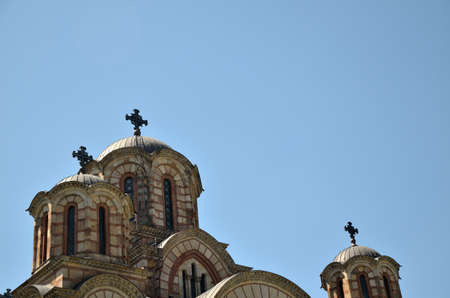 Domes with crosses of an Orthodox church, under clear blue sky