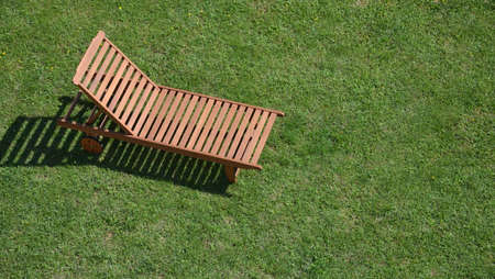 Easy chair on a lawn shot from aboveの写真素材
