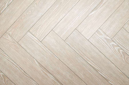 Beige floor tiles with look of parquet arranged in herringboneの写真素材