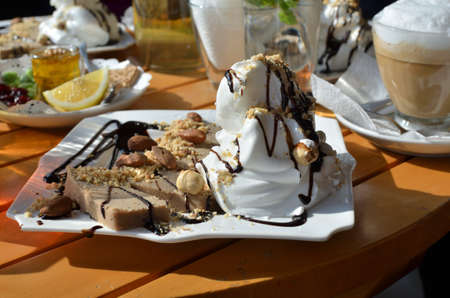 Chestnut puree served with cream, chocolate, almonds and hazelnutsの写真素材