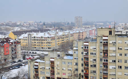 Residential buildings at the end of a winter during a dayの写真素材