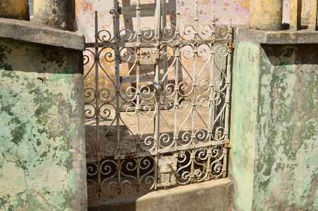 Closed old iron fence locked with chain and lock