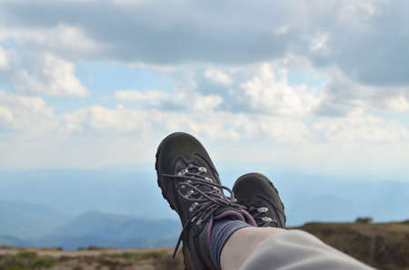 Legs in tracking shoes on a mountain highの写真素材
