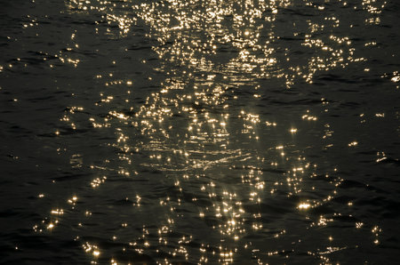 Glittering sea surface in sunset suitable as a background