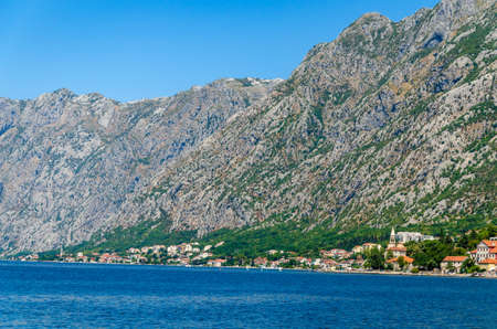 Small mediterranean town of Dobrota, in the Bay of Kotor shot from the sea