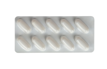 Tablets in a white blister package isolated from background