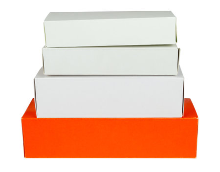 Pile of red and white cardboard boxes isolated from backgroundの写真素材