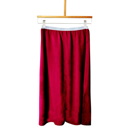 Create The Best Style For Your Design Or Logo With This Front View Beauty Skirt Mockup In Dark Sangria Color With Hangerの写真素材