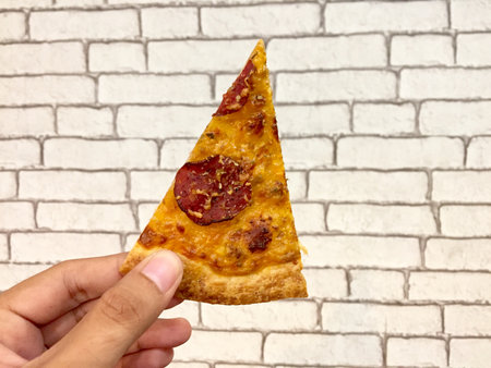 Hand held pizza slice
