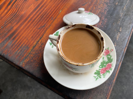 a cup of classic coffee on a wooden tableの写真素材