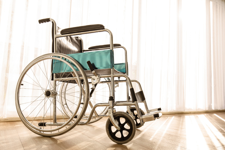 Wheelchair parking in the hospital room with sunlight in background, concept for the health care of elderly or the disabled.の写真素材