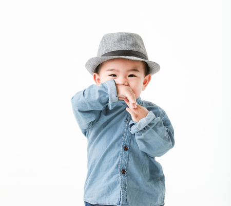 One year old Asian baby boy in jeans shurt look at camera  isolated on white background studio close up shot.の写真素材