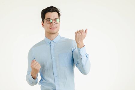 Young hipster office man feeling very happy excited fun, portrait shot isolated on white background.の写真素材