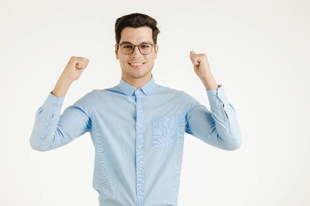 Young hipster office man feeling very happy excited fun, portrait shot isolated on white background.の写真素材