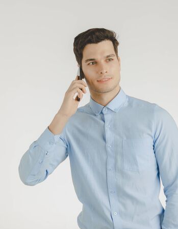 Young hipster man, confident happy smile talking on phone for business work, portrait isolated on white background.の写真素材