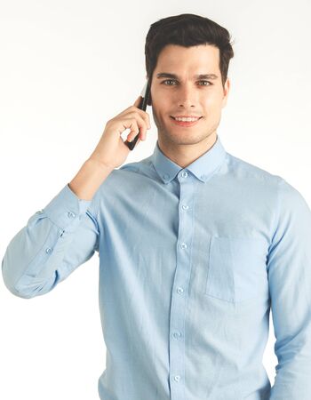 Young hipster man, confident happy smile talking on phone for business work, portrait isolated on white background.の写真素材