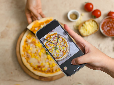 Unrecognizable person using smartphone taking photo top view shot of delicious tasty juicy corn and...