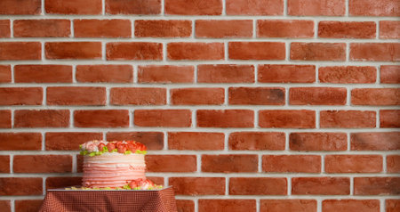 Pink charming multi-layer cake with decorated topping cream as beautiful roses put on table for served dessert for love celebration at vintage valentine party beside brown brick wall of restaurant.の写真素材