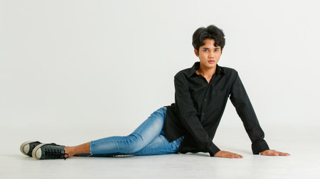 Portrait isolated cutout studio shot of Asian young LGBTQ gay glamour male model in casual black...