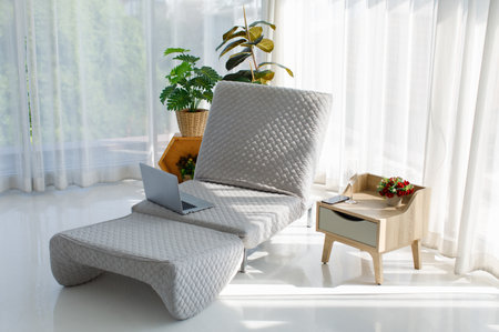 Cozy relaxation resting adjustable sofa couch placed in full decoration modern living room with...
