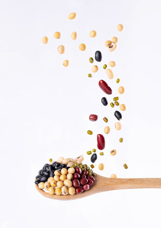 Multigrain, 5 kinds of bean splash in wooden spoon on isolated on white background, Stop motion, food and drink object design.の写真素材