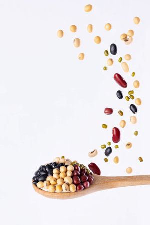 Multigrain, 5 kinds of bean splash in wooden spoon on isolated on white background, Stop motion, food and drink object design.の写真素材