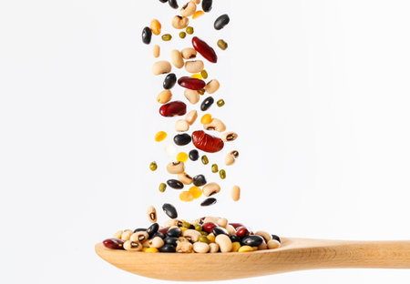 Multigrain, 5 kinds of bean splash in wooden spoon on isolated on white background, Stop motion, food and drink object design.の写真素材