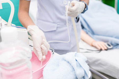 Nurse use Suction Machine, prepare to suction patient's mucus. Soft focus.の写真素材