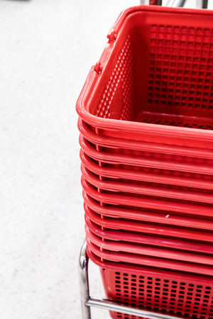 Red Shopping baskets in supermarket. Closed-up.の写真素材