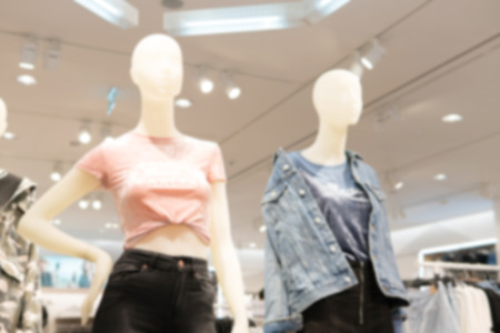 blurry background of Inside the expensive clothes shop. There is a Dummy show clothes.の写真素材