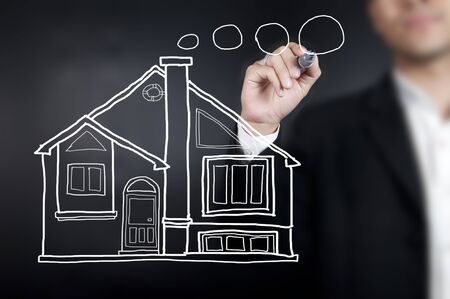 Hand drawing a houseの写真素材