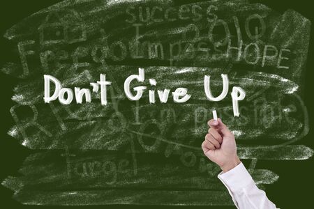 Writing word don t give upの写真素材