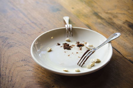 Eaten brownies on dirty plateの写真素材