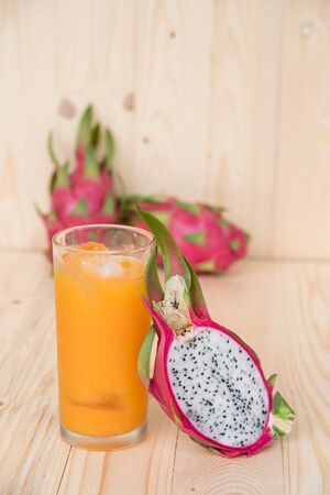 Dragon Fruit and Orange Juice on Wooden Backgroundの写真素材