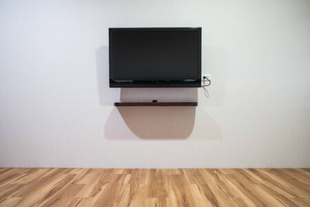 Empty room with HD TV at the wall