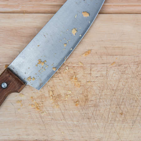 Closeup of Kitchen Knife on a wooden