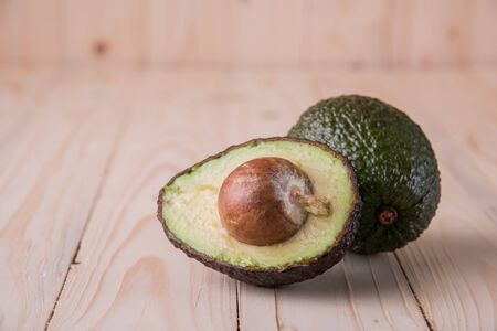 Food Background with Fresh Organic Avocado on wooden Backgroundの写真素材