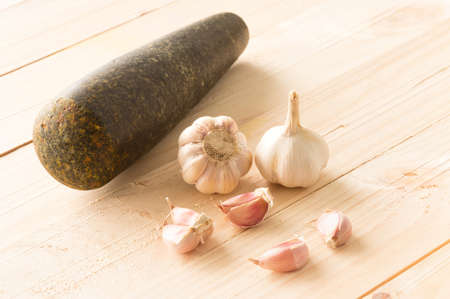 Some Garlic on Wooden Boardの写真素材