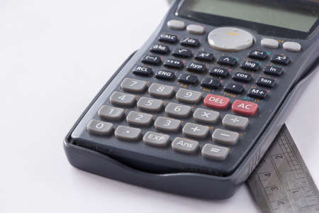 Old Calculator and Ruler on White Backgroundの写真素材
