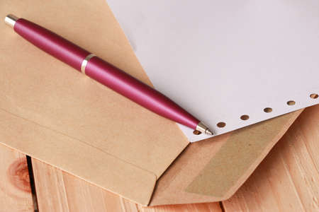 Violet Pen on Document Holder and Paper on Woodenの写真素材