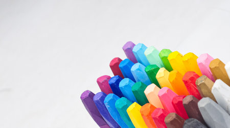 a group of crayon sticks arranged neatly visible at the tip of the pencilの写真素材
