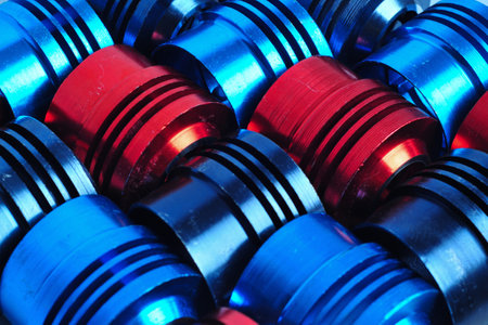 Colorful metal tubes of motorbike parts are neatly arrangedの写真素材