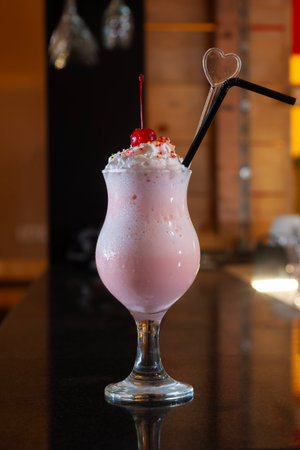 Iced Merry Strawberry Frappe is a cold drink made from strawberry flavored syrup mixed with whipped creamの写真素材