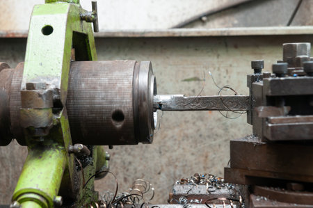 metalworking from a manual bench lathe machine where the machine is smoothing the inner side of...