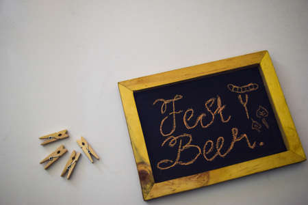 Celebrate october festival - clothes pins on grey/white background and a chalkboard with the slogan "Fest Beer"の写真素材