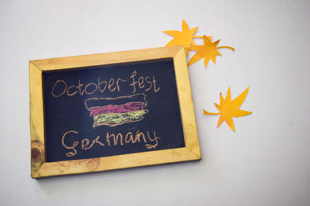 Celebrate october festival - clothes pins on grey/white background and a chalkboard with the slogan "October Fest Germany"の写真素材