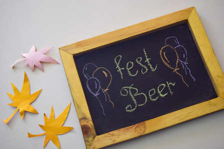 Celebrate october festival - clothes pins on grey/white background and a chalkboard with the slogan "Fest Beer"の写真素材
